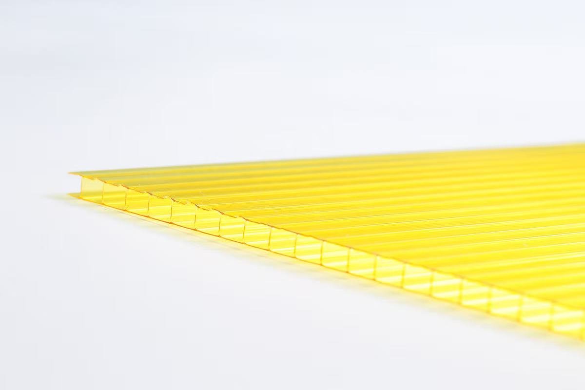 37c440996934bf9232d038ab3fa342f2 - Close-up of yellow plastic binding combs laid in a row for document binding