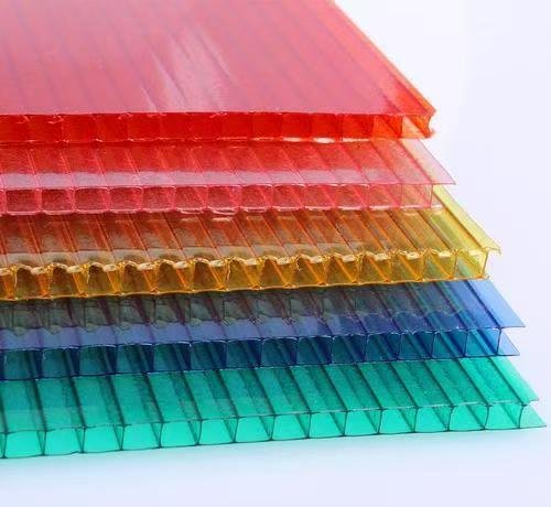 3aac999c5701e9f01c238103b090ba2c - Stack of translucent colored acrylic sheets arranged in a rainbow gradient (red to teal).