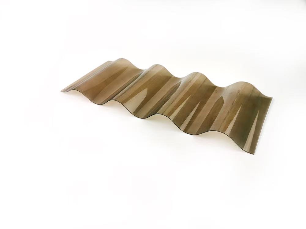 b10df62d2cea48beb41e821775f17ecd - Bronze-colored corrugated metal sheet with large sine-wave folds on a white background.