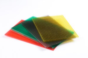 微信图片_20260413135456_425_159 - Stack of translucent colored acrylic sheets in red, green, teal, and yellow overlapping on a white background.