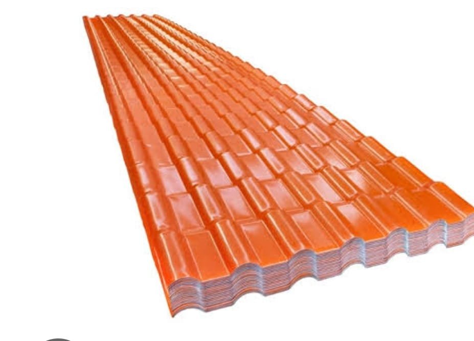 22f3f4d49dc1843fd031e9f30f97b1a5 - Stack of orange corrugated metal roofing sheets laid in a neat pile, seen from an angle.